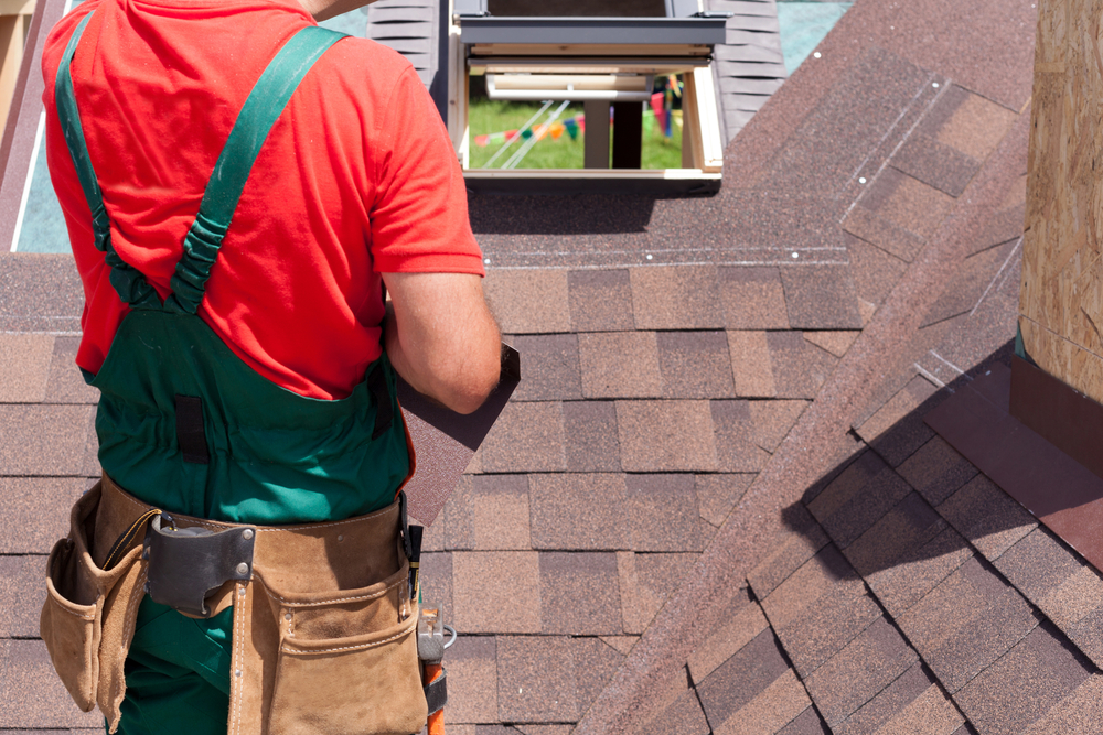roofer inspecting a roof